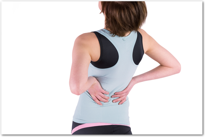 Woman with back injury on white background
